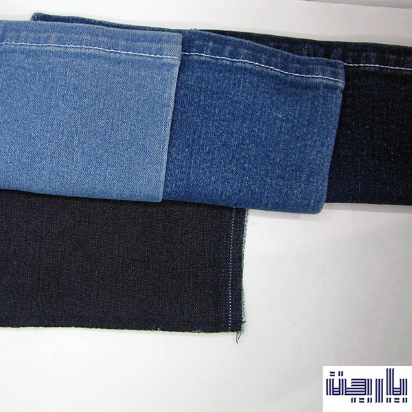 نمای تا شده و دوخته شده از لبه پایینی شلوار جین در دو رنگ آبی و آبی روشن www.parchat.ir